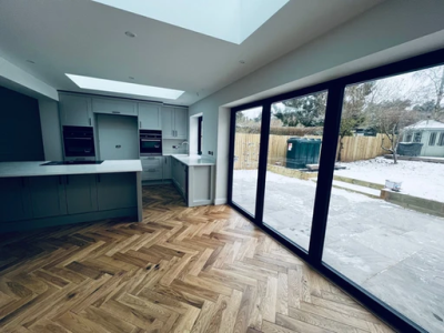 The room has very large windows - a bright space.