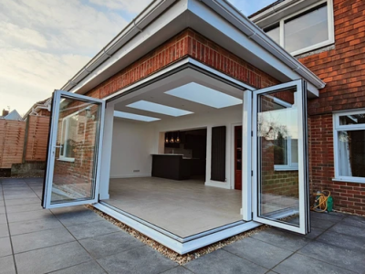 Finished extension to the house - addition with large corner door